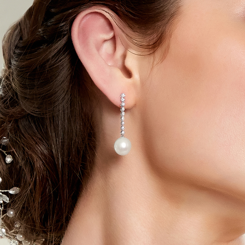Model is wearing Serena earrings with 10mm AAAA quality pearls