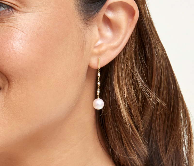 Model is wearing Estelle earrings with 9mm AAAA quality pearls
