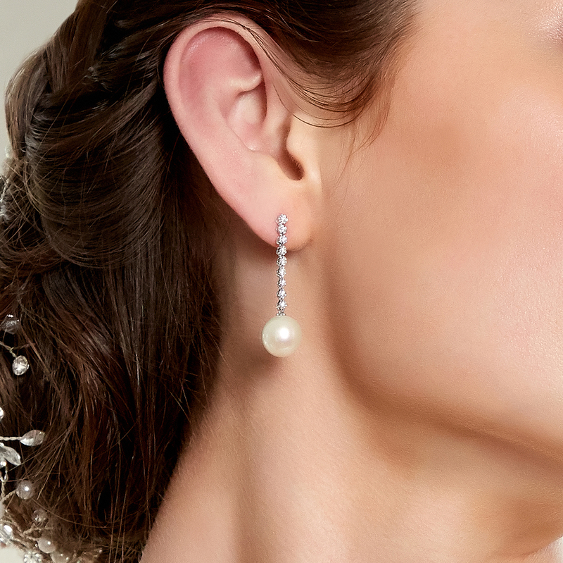 Model is wearing Serena earrings with 9.5-10mm AAA quality pearls